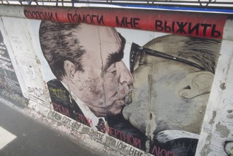 Artwork shows Leonid Brezhnev and Erich Honecker kissing, painting was created in 1990 at the