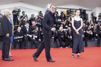 Venice, Italy - 1 September 2025: Sebastian Koch and Julia Windischbauer (r.) on the red carpet of