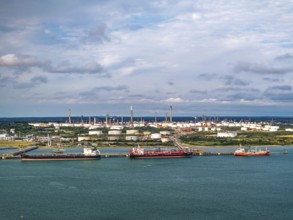 Gas tankers over refinery Esso Oil Terminal from drone, Southampton, Hampshire, England, United