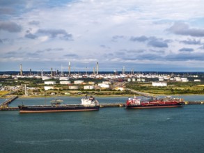Gas tankers over refinery Esso Oil Terminal from drone, Southampton, Hampshire, England,