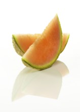 Cantaloupe melon, 2 melon slices against a white background