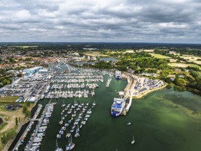 Wight Light car ferry to Isle of Wight on Lymington River and marina from drone, Lymington, New