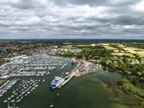 Wight Light car ferry to Isle of Wight on Lymington River and marina from drone, Lymington, New