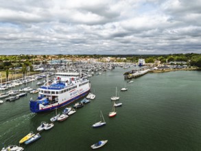 Wight Light car ferry to Isle of Wight on Lymington River and marina from drone, Lymington, New