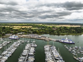 Wight Light car ferry to Isle of Wight on Lymington River and marina from drone, Lymington, New