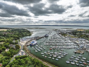 Wight Light car ferry to Isle of Wight on Lymington River and marina from drone, Lymington, New
