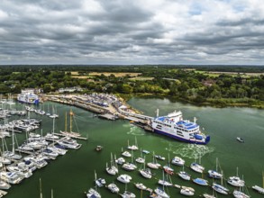 Wight Light car ferry to Isle of Wight on Lymington River and marina from drone, Lymington, New