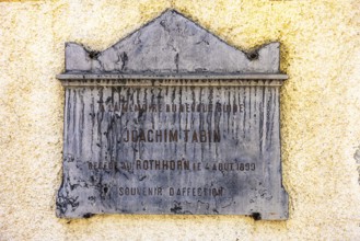 Weathered memorial plaque to the mountaineer Joachim Tabin, Saint Barthelemy church, Val