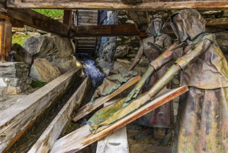 Copper sculptures of two washerwomen at the historic washing place, Saint Luc, Val d'Anniviers,