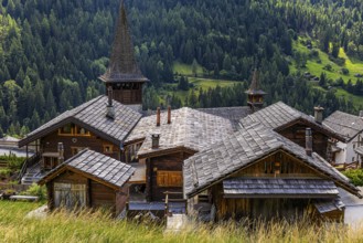 Houses with wooden shingle roofs, behind the church of Saint Anna, Ayer, Val d'Anniviers, Valais