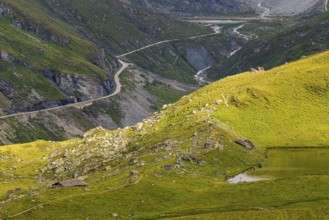 A pass road leads to the Moiry glacial lake, above Grimentz, Val d'Anniviers, Valais Alps, Canton