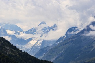 Four-thousand metre mountains and glaciers in clouds, above Zinal, Val d'Anniviers, Valais Alps,