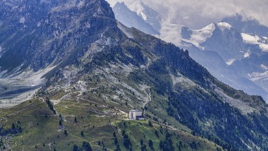 The historic Hotel Weisshorn below the Weisshorn mountain, behind the four-thousand-metre peaks and
