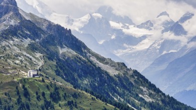The historic Hotel Weisshorn below the Weisshorn mountain, behind the four-thousand-metre peaks and