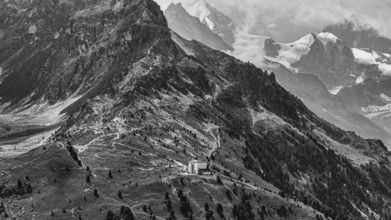 The historic Hotel Weisshorn below the Weisshorn mountain, behind the four-thousand-metre peaks and