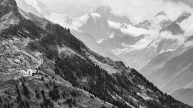 The historic Hotel Weisshorn below the Weisshorn mountain, behind the four-thousand-metre peaks and