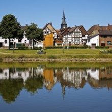 View over the river Weser to the old town centre of Bodenwerder with the church tower of St.
