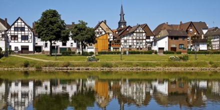 View over the river Weser to the old town centre of Bodenwerder with the church tower of St.