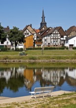 View over the river Weser to the old town centre of Bodenwerder with the church tower of St.