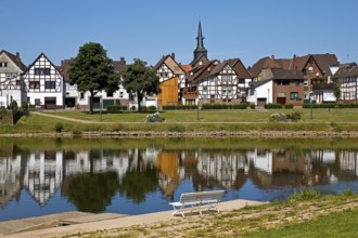 View over the river Weser to the old town centre of Bodenwerder with the church tower of St.