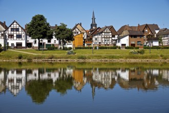 View over the river Weser to the old town centre of Bodenwerder with the church tower of St.