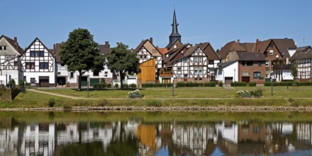 View over the river Weser to the old town centre of Bodenwerder with the church tower of St.