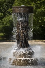 Fountain of Knowledge by Heinrich Jobst in the large spa gardens of Bad Nauheim, Hesse, Germany