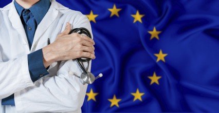 Doctor with stethoscope on European Union flag. Doctor holding stethoscope on European Union flag