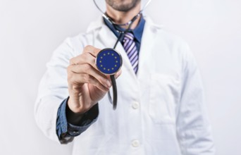 European Union healthcare system, doctor holding stethoscope. European Union health and medical