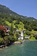 View of the village with the Roman Catholic Church of St Idda, Lake Lucerne in the background,
