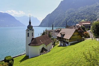 View of the village with the Roman Catholic Church of St Idda, Lake Lucerne in the background,