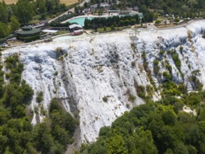 White limestone formation with lush vegetation, geological structure, aerial view, Akkaya