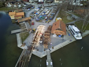 Raft of felled tree trunks at the landing stage where the trunks are pulled ashore and cut to size