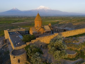 A historic monastery in the morning light in front of Mount Ararat, aerial view, Chor Wirap