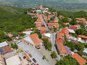 Hilly street view with traditional buildings and panoramic distant view, aerial view, Sighnaghi,