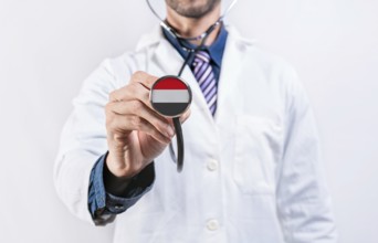 Yemen healthcare system, doctor holding stethoscope. Yemen health and medical insurance concept