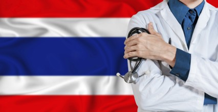 Doctor with stethoscope on Thailand flag. Doctor holding stethoscope on Thailand flag