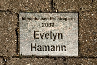 Sign for the 2002 Münchhausen Prize winner Evelyn Hamann in the Münchhausen town of Bodenwerder,