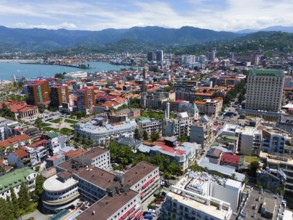 Urban environment with densely built-up areas and mountain backdrop, aerial view, Batumi, Black