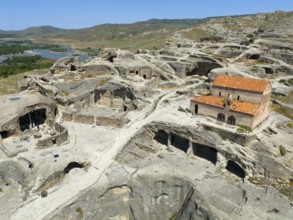 Architecture of the ancient cave city of Uplistsikhe with ruins and spectacular rock panorama,