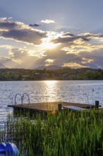 Bathing jetty at sunset on the lake near Neuegg am Faaker See, Carinthia, Austria