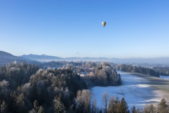Hot air balloon in winter over Bad Heilbrunn, Upper Bavaria, Bavaria, Germany