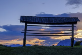 Sunset, hayrack, hayrack, at the ruins of Finkenstein Castle, on Lake Faak, Carinthia, Austria