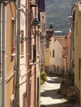 Sardinia, Narrow alley with picturesque house and window with streetlights, Bosa, Europe, Province