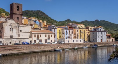 Sardinia, Town view, Residential houses on the river Temo and church tower, Bosa, Europe, Province
