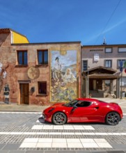 Sardinia, house with mural, Sardinia landmark, red sports car, Tinnura, Europe, Oristano province,