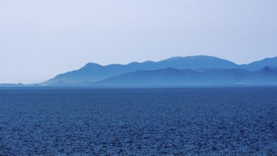 Sardinia, sea and mountains dipped in blue colour, Tharros, Europe, Province of Oristano, Italy,