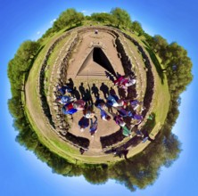 Sardinia, fisheye shot of a tourist group at a Roman bathing complex, Paulilatino, Europe, Oristano
