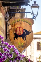 Sardinia, business sign with wild boar and target, Bosa, Europe, Province of Oristano, Italy,