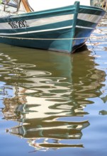 Sardinia, front of a fishing boat with reflection in the river Temo, Bosa, Europe, Province of
